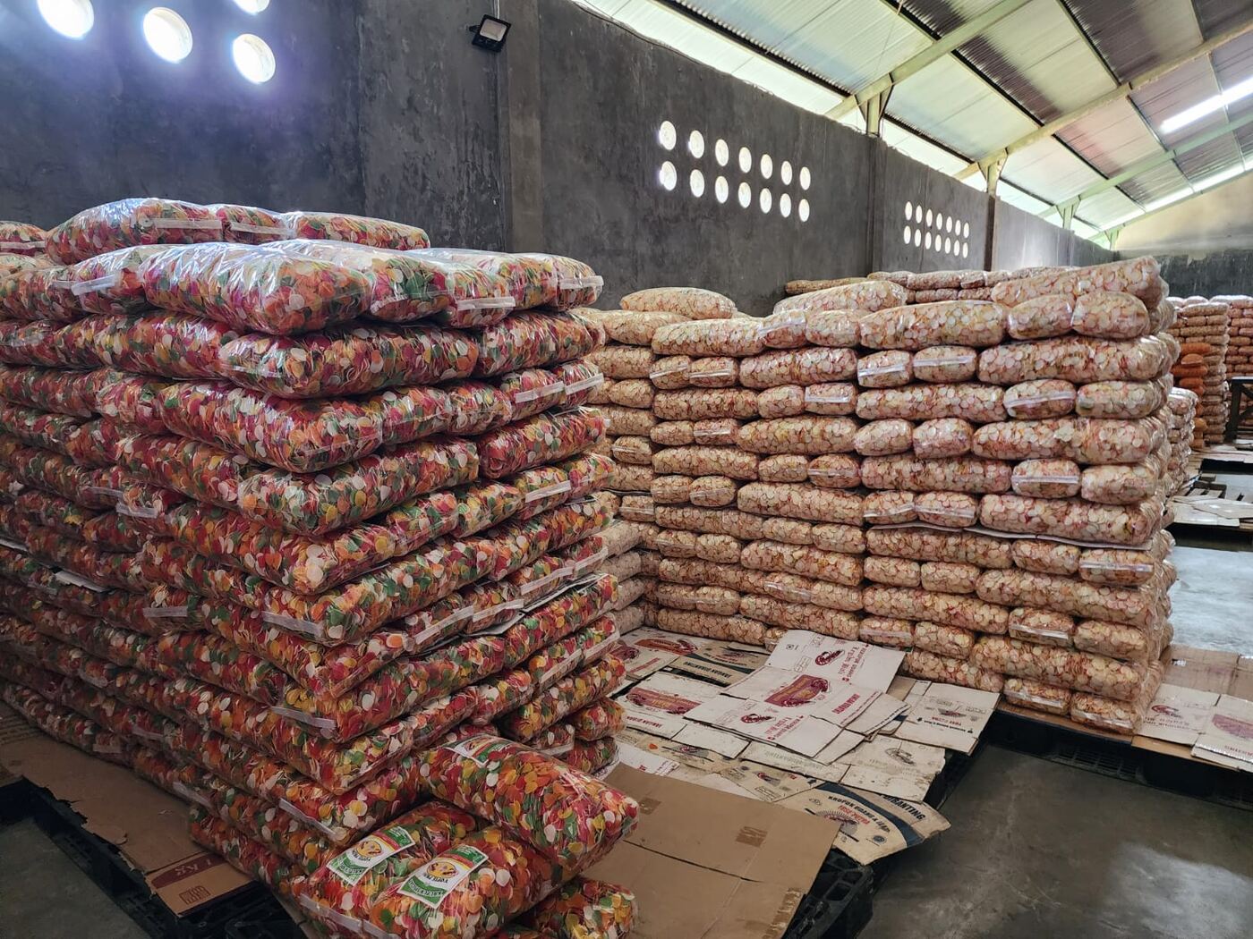 Variety of packaged cracker products stored at AshaFry warehouse