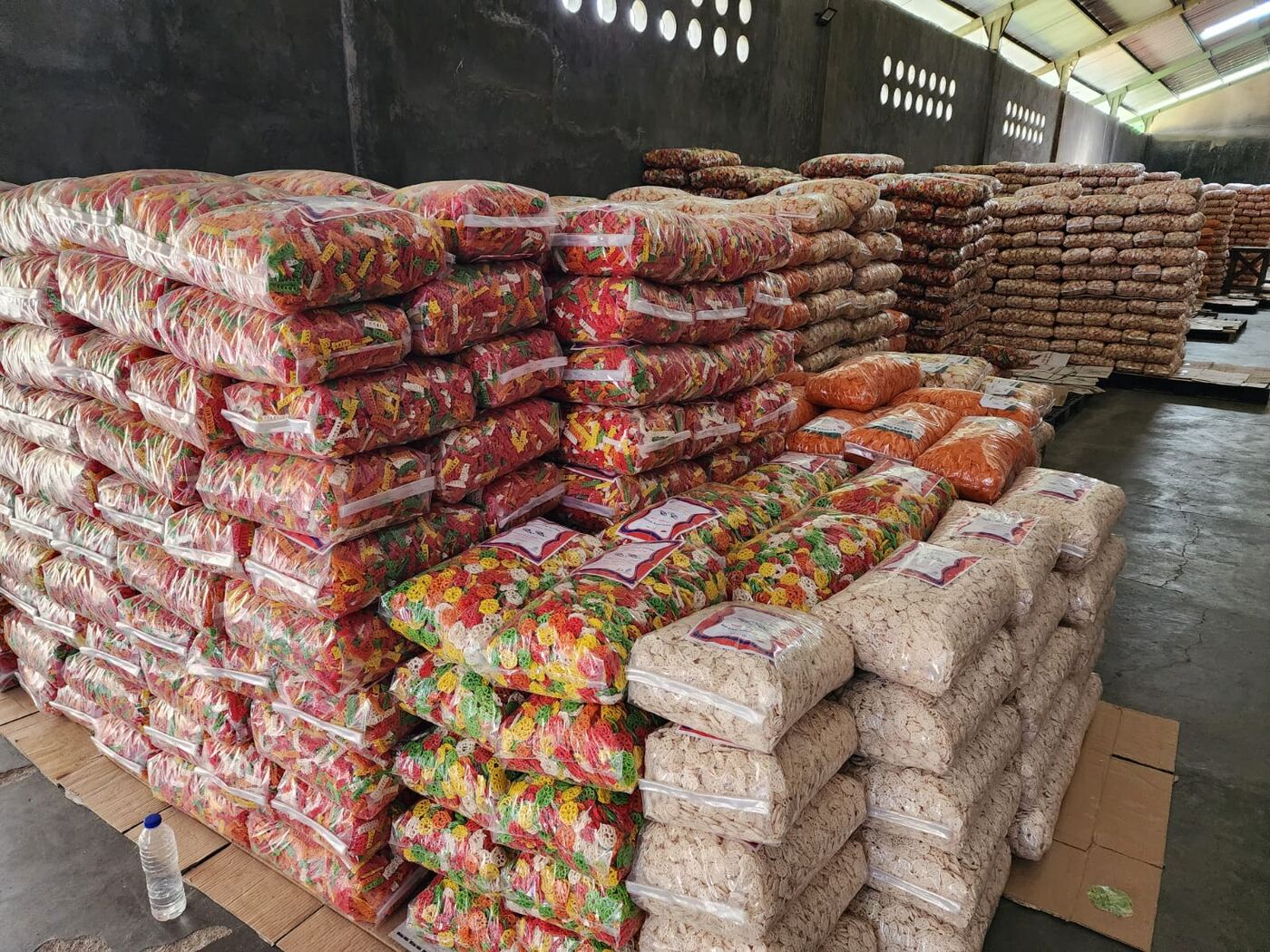 AshaFry warehouse full of packaged crackers ready for distribution